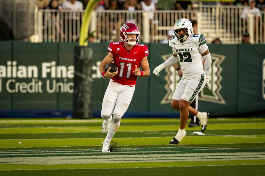 UNLV quarterback Jackson Arnold runs with the football against Hawaii.
